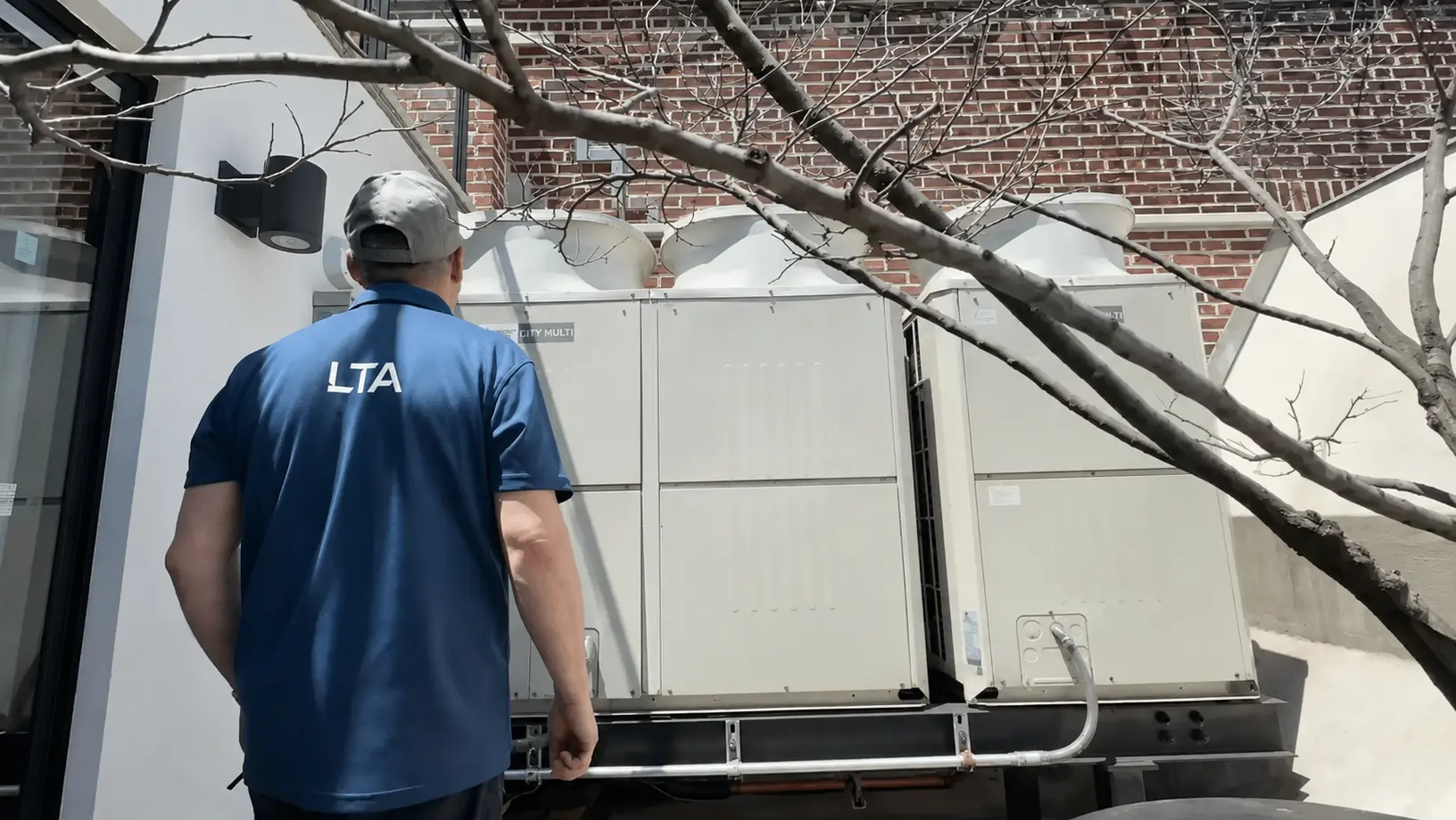 LTA technician servicing a commercial HVAC system